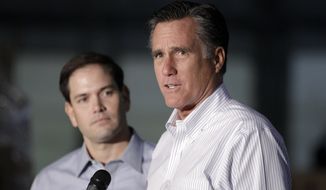GOP presidential candidate Mitt Romney (right) talks to reporters on Monday, April 23, 2012, as he is joined by Sen. Marco Rubio, Florida Republican, during a news conference before a town-hall-style meeting in Aston, Pa. (Associated Press)