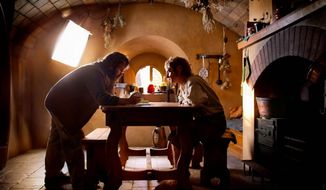 Peter Jackson consults with Martin Freeman on the set of &quot;The Hobbit, An Unexpected Journey.&quot; Introducing footage from the film that uses 48 frames per second, he warned that it would take time to adjust to the new approach. (Warner Bros. Pictures)