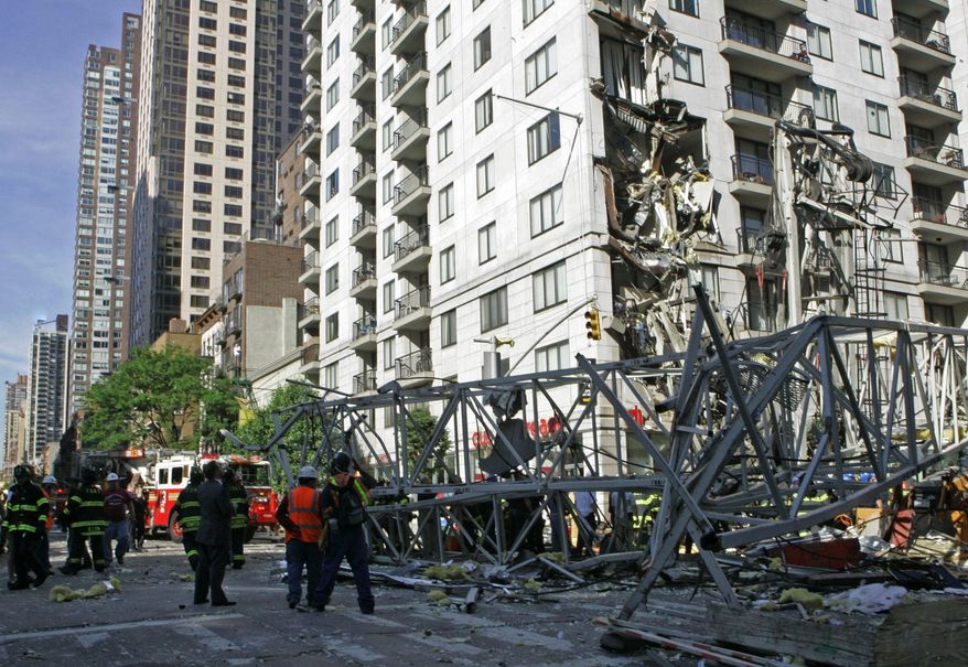 **FILE** Rescue crews work at the scene of a May 2008 crane collapse on New York's Upper East Side. (Associated Press)