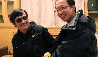 In this photo taken in late April, 2012, and provided by Hu Jia, blind Chinese legal activist Chen Guangcheng, left, meets with Hu at an undisclosed location. Chen, an inspirational figure in China&#39;s rights movement, slipped away from his well-guarded rural village on Sunday night, April 22, 2012, and made it to a secret location in Beijing on Friday, April 27, setting off a frantic police search for him and those who helped him, activists said. (AP Photo/Courtesy of Hu Jia)