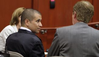 ** FILE ** George Zimmerman, left, speaks with his attorney Mark O&#39;Mara as he appears before Circuit Judge Kenneth R. Lester Jr. Friday, April 20, 2012, during a bond hearing in Sanford, Fla. (AP Photo/Orlando Sentinel, Gary W. Green, Pool)