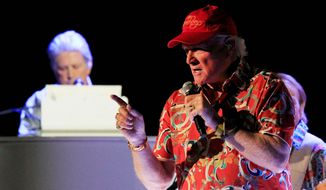 Mike Love sings and Brian Wilson plays the piano during the opening show of the Beach Boy&#39;s 50th anniversary tour in Arizona. &quot;We&#39;re slaves to the Beach Boys legacy,&quot; said David Marks, who recorded four albums with the group. &quot;We&#39;re just out there trying to keep that legacy alive.&quot; (Associated Press)
