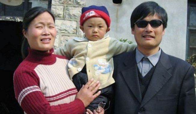 Chinese activist Chen Guangcheng is seen with his wife, Yuan Weijing, and son, Chen Kerui, in an undated photo in China. His escape from house arrest into the reported protection of U.S. diplomats in Beijing poses a delicate U.S.-China issue. (China Aid Association via Associated Press)