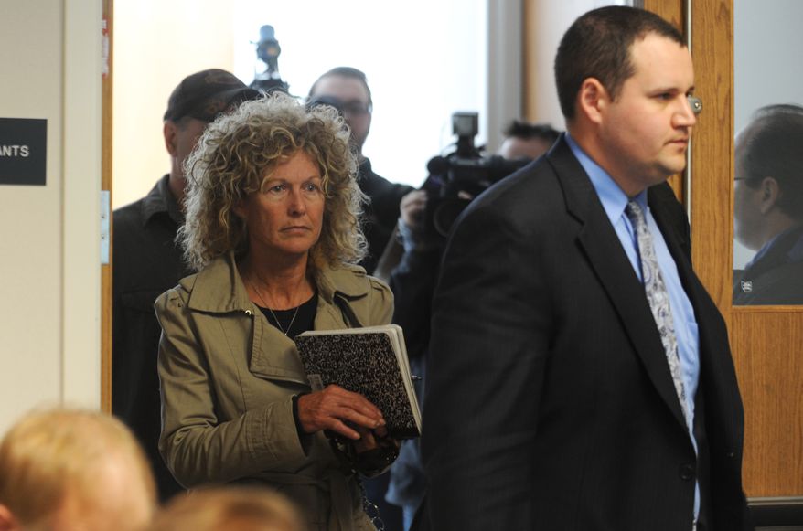 Marian Thompson (left) follows her attorney, Bob McClelland, into a hearing at the Ohio Department of Agriculture in Reynoldburg, Ohio, on Monday, April 23, 2012. (AP Photo/Chris Crook, Times Recorder)