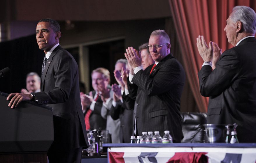 President Obama receives a standing applause from labor leaders as he speaks April 30, 2012, at the Building and Construction Trades Department Legislative Conference in Washington. (Associated Press)