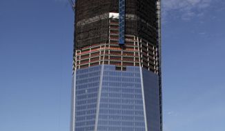 ** FILE ** In this April 17, 2012, photo, One World Trade Center, now up to 100 floors, rises above the Manhattan skyline in New York. On Monday, April 30, One World Trade Center — being built to replace the twin towers destroyed on 9/11 — gets steel columns to make its unfinished framework a little higher than the Empire State Building&#39;s observation deck, to become the tallest building in New York. (AP Photo/Mark Lennihan)