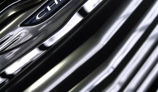 ** FILE ** This Tuesday, Jan. 31, 2012, file photo shows the grill of a 2012 Chrysler 200 in a showroom in South Burlington, Vt. (AP Photo/Toby Talbot)