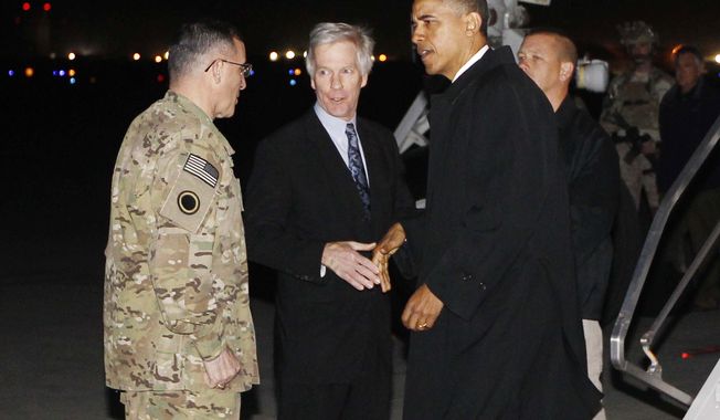 President Barack Obama is greeted by Lt. Gen. Curtis &quot;Mike&quot; Scaparrotti, and U.S. Ambassador to Afghanistan Ryan Crocker as he steps off Air Force One at Bagram Air Field in Afghanistan, Tuesday, May 1, 2012. (AP Photo/Charles Dharapak)