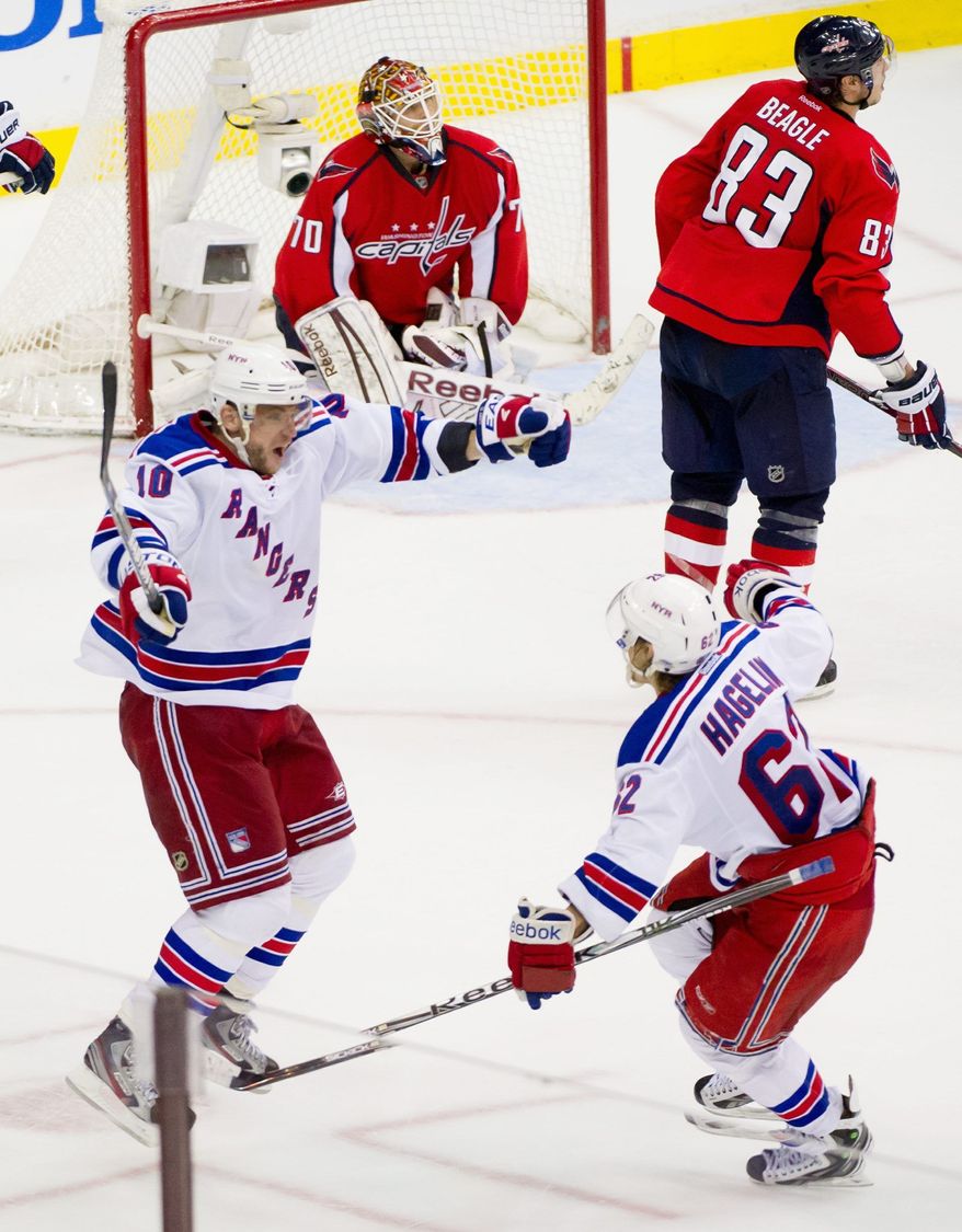 New York Rangers forwards Marian Gaborik and Carl Hagelin celebrate Gaborik's goal in the third overtime period Wednesday night. The Capitals need a bounce-back performance from rookie goalie Braden Holtby, who has gone 25 NHL games without back-to-back losses. (Andrew Harnik/The Washington Times)