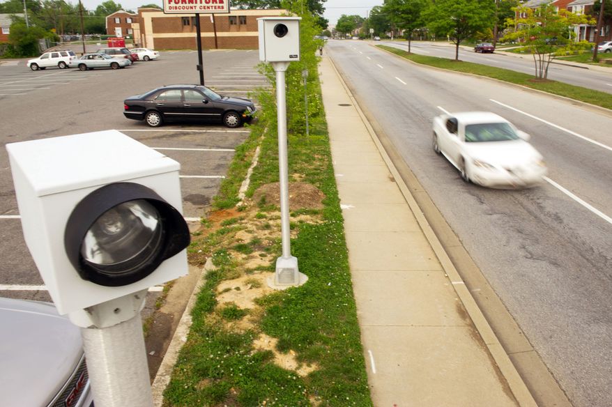 A speed camera on Iverson Street in the Hillcrest Heights area of Prince George's County stands ready Wednesday to catch motorists who exceed the posted speed limits. (Andrew Harnik/The Washington Times)
