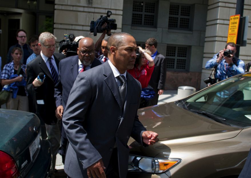 Former D.C. Council member Harry Thomas Jr. makes his way to a waiting car after his sentencing at the E. Barrett Prettyman United States Courthouse in Washington, D.C., Thursday, May 3, 2012. (Rod Lamkey Jr/The Washington Times)