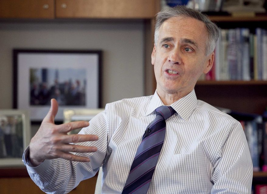 In this April 25, 2012, photo, Tom Curley, President and CEO of the Associated Press, discusses the work of former AP correspondent Ed Kennedy during an interview in New York. Curley co-wrote the introduction to the book, “Ed Kennedy’s War: V-E Day, Censorship & The Associated Press.” (AP Photo/Mark Lennihan)