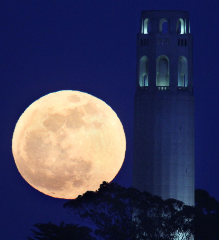 The "supermoon" rises beside the Coit Tower in San Francisco on Saturday, May 5, 2012. (AP Photo/Frederic Larson, San Francisco Chronicle)