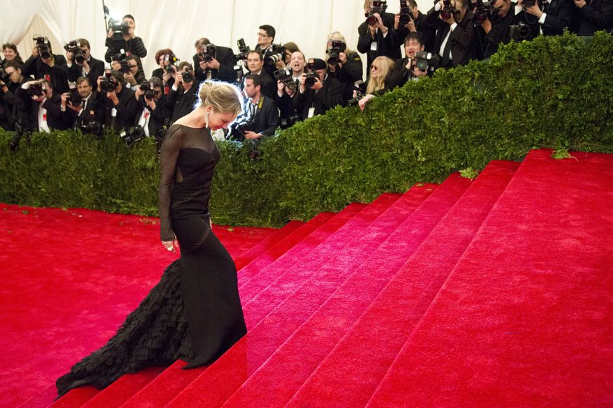 Renee Zellweger arrives May 7, 2012, at the Metropolitan Museum of Art Costume Institute in New York for a gala benefit celebrating Elsa Schiaparelli and Miuccia Prada. (Associated Press)