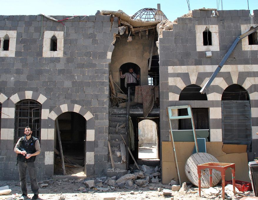This historic house in the al-Hamidiya neighborhood of the old city Homs was shelled by Syrian security forces. The chaos from Syria's yearlong revolt is destroying some of the country's most important archaeological sites and old buildings. Horrified experts warn that some of the Middle East's most precious sites are at risk of destruction and looting. (Associated Press)