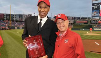 Local basketball star Adrian Dantley poses with principal owner of the Washington Nationals Mark Lerner after being inducted into the Washington DC Sports Hall of Fame on Sunday May 6, 2012. (Courtesy of the Washington Nationals)