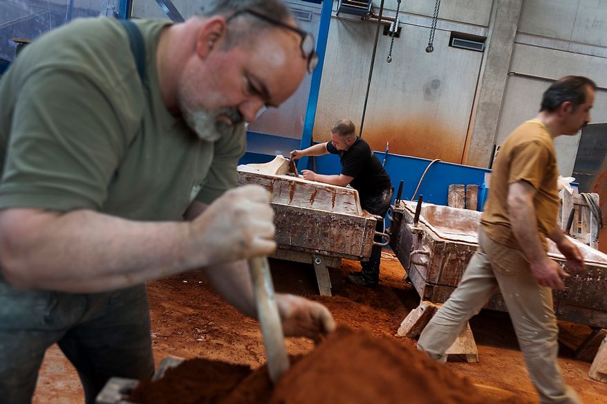 Manfred Koch, Oliver Seewald and Nevzat Guney (from left), employee at Noack Bronze-casting foundry, is preparing a mold to cast a bronze. Thursday, April 26, 2012. Noack is arguably the most important bronze-casting foundry in Germany, based in Berlin. Daniel Pilar/Special to The Washington Times