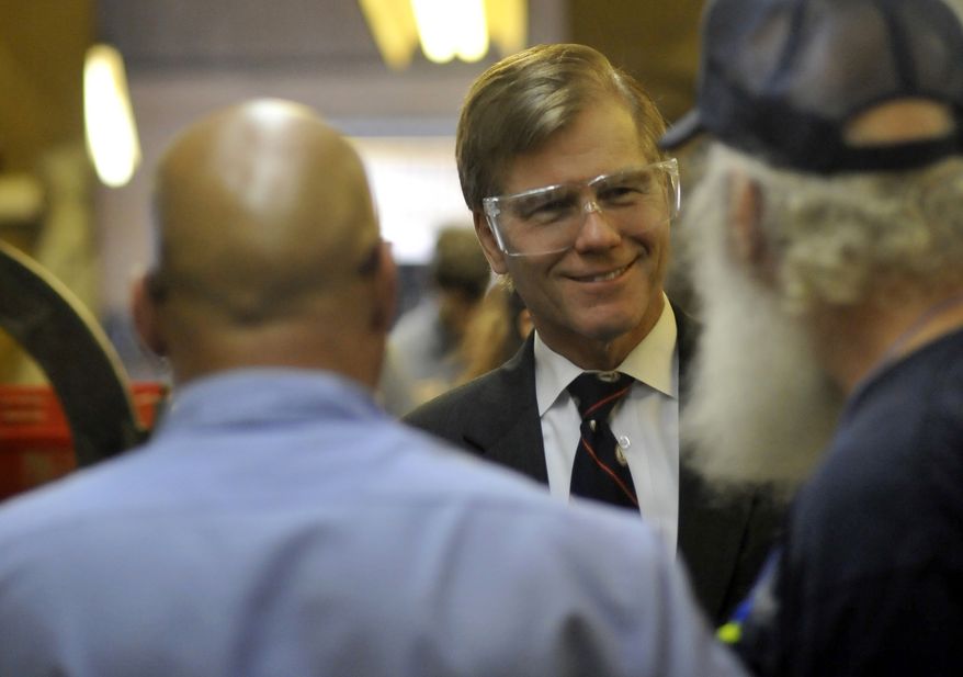 Gov. Bob McDonnell speaks with workers at Fredericksburg Machine and Steel, a family owned and run shop in Fredericksburg on Tuesday, May 8, 2012 as part of his tour of Virginia to tout it as a business friendly state. (AP Photo/The Free Lance-Star, Reza A. Marvashti)
