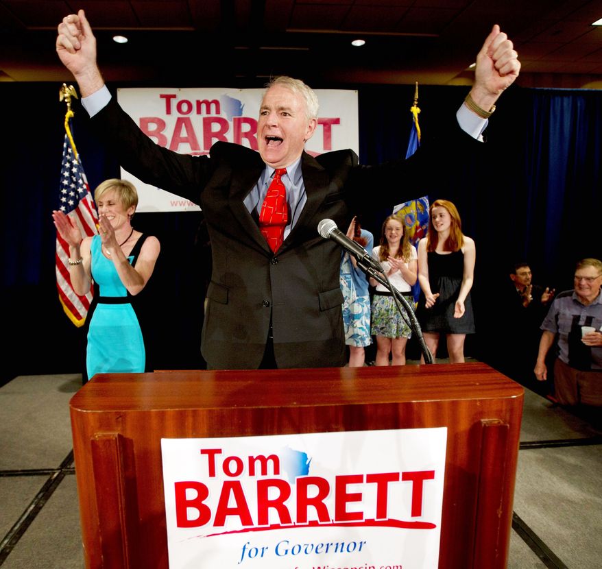 Tom Barrett, Wisconsin's Democratic gubernatorial candidate, celebrates at the party for his primary election victory in Milwaukee on Tuesday. He will face Gov. Scott Walker in a June recall election. (Associated Press)