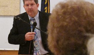 U.S. Postmaster General Patrick Donahoe talks April 12, 2012, to Ingomar, Mont.-area residents about rural post office closures he says are needed as part of cost-cutting moves. (Associated Press)