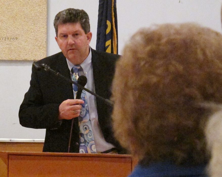 U.S. Postmaster General Patrick Donahoe talks April 12, 2012, to Ingomar, Mont.-area residents about rural post office closures he says are needed as part of cost-cutting moves. (Associated Press)