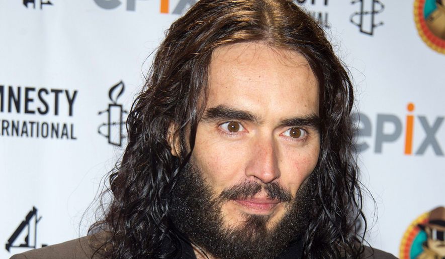 Comedian and stand-up artist Russell Brand arrives at Amnesty International&#39;s Secret Police Ball in New York City in 2012. ** FILE **