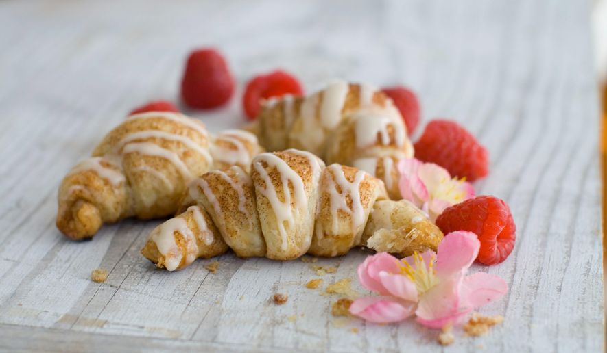 The trick to making delicious croissants comparatively quickly is to outsource the pastry. And try adding some berries before serving warm. (Associated Press)