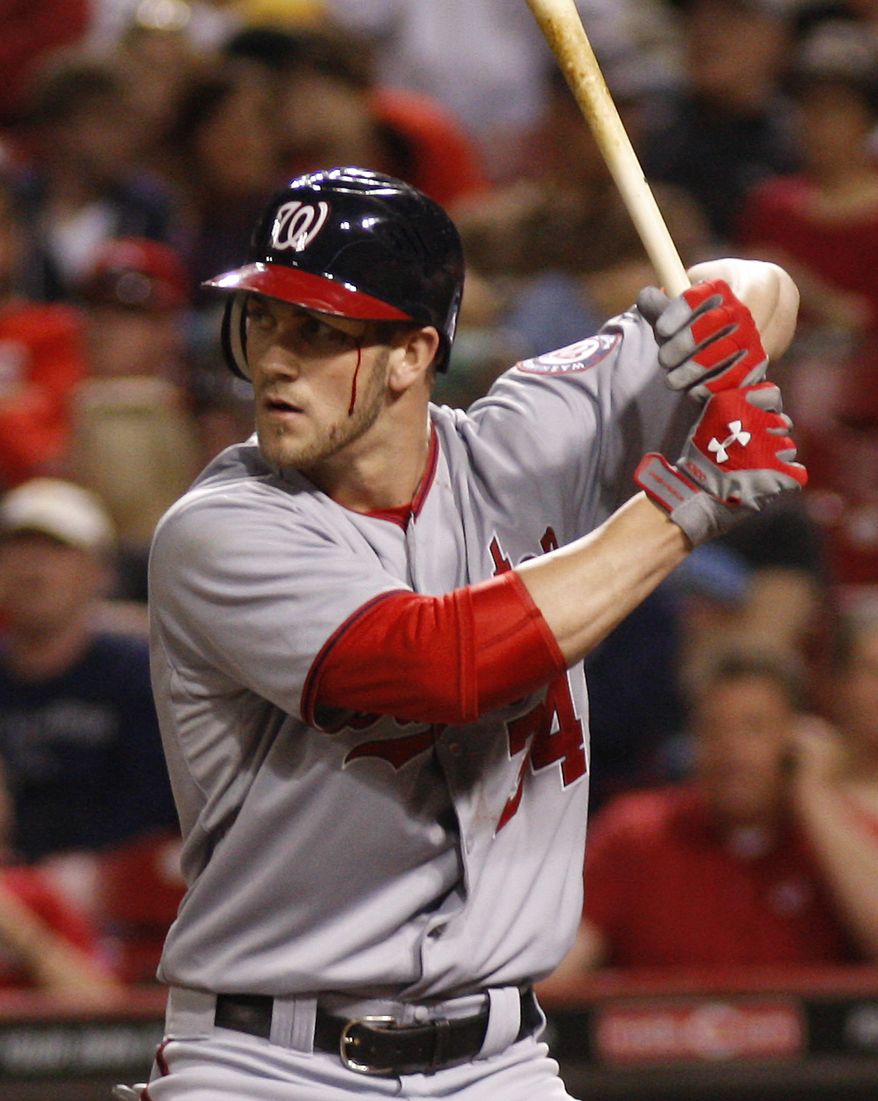 Washington Nationals' Bryce Harper waits for a pitch from Cincinnati Reds pitcher Sam LeCure during the ninth inning Friday, May 11, 2012, in Cincinnati. The Nationals won 7-3. (AP Photo/David Kohl)