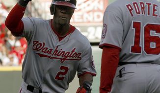 Washington Nationals&#39; Roger Bernadina heads toward home plate past after hitting a two-run home run off Cincinnati Reds starting pitcher Mike Leake during the first inning on Friday, May 11, 2012, in Cincinnati. (AP Photo/David Kohl)

