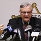 A defiant Maricopa County Sheriff Joe Arpaio pounds his fist on the podium as he answers questions regarding the Department of Justice announcing a federal civil lawsuit against him and his department, during a news conference Thursday, May 10, 2012, in Phoenix. (AP Photo/Ross D. Franklin)

