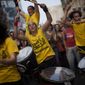 Demonstrators play drums as they march in a protest to mark the anniversary of the beginning of the &quot;Indignados&quot; movement in Barcelona, Spain, Saturday, May 12, 2012. Spanish activists angered by grim economic prospects planned nationwide demonstrations Saturday to mark the one-year anniversary of their protest movement that inspired similar groups in other countries. (AP Photo/Emilio Morenatti)