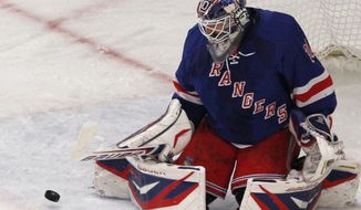 Goalie Henrik Lundqvist made 22 saves as the New York Rangers advanced to the Eastern Conference final with a 2-1 win over the Washington Capitals on Saturday night. (AP Photo/Kathy Willens)
