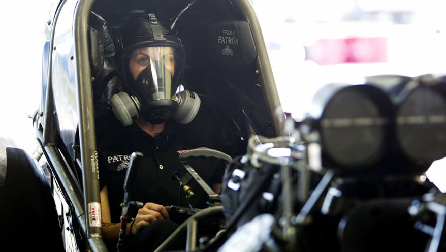 Alexis DeJoria straps herself into her funny car in Jupiter, Fla. She is a ranked National Hot Rod Association driver and the second woman to win a National event in funny car. (AP Photo/J Pat Carter)