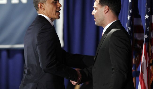 President Barack Obama, left, is introduced by singer Ricky Martin at a fundraiser hosted by Martin and the LGBT Leadership Council at the Rubin Museum of Art, Monday, May 14, 2012, in New York. (AP Photo/Pablo Martinez Monsivais)