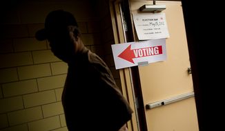 A D.C. resident who declined to give his name walks into a University of the District of Columbia Community College building, to cast a vote in a special election in this May 15, 2012 file photol. (Andrew Harnik/The Washington Times)  **FILE**