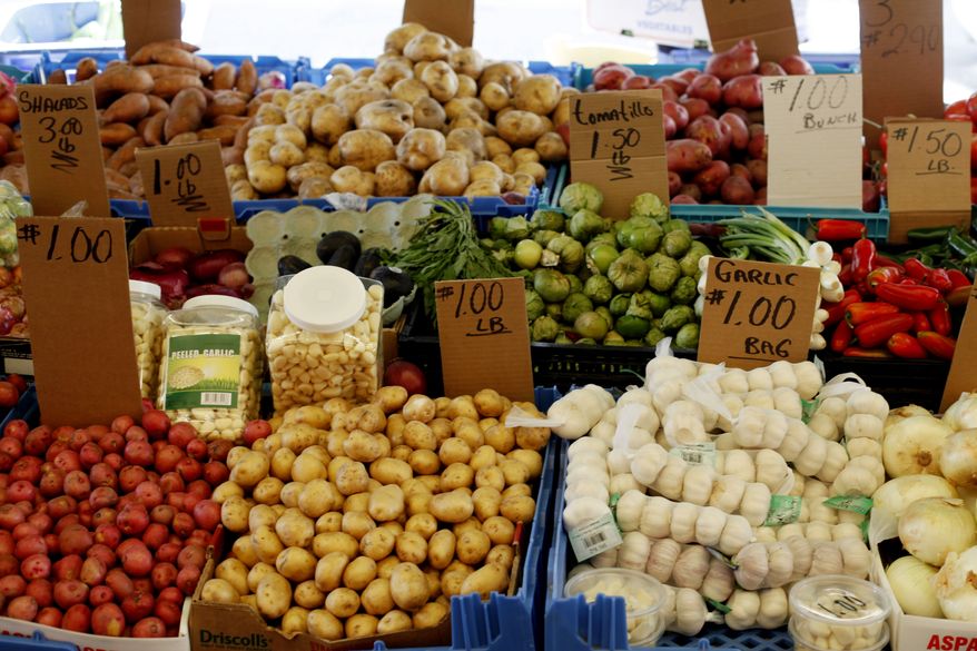 Vegetables are on display at a stand at the Italian Market in Philadelphia on Thursday, April 12, 2012. Fruit and vegetable prices jumped 1 percent in April, the most since July. (AP Photo/Matt Rourke)
