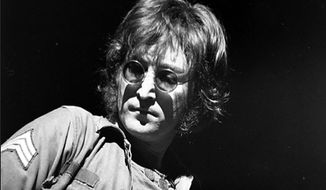 **FILE**  John Lennon performs at New York&#39;s Madison Square Garden on Aug. 30, 1972. (Associated Press)