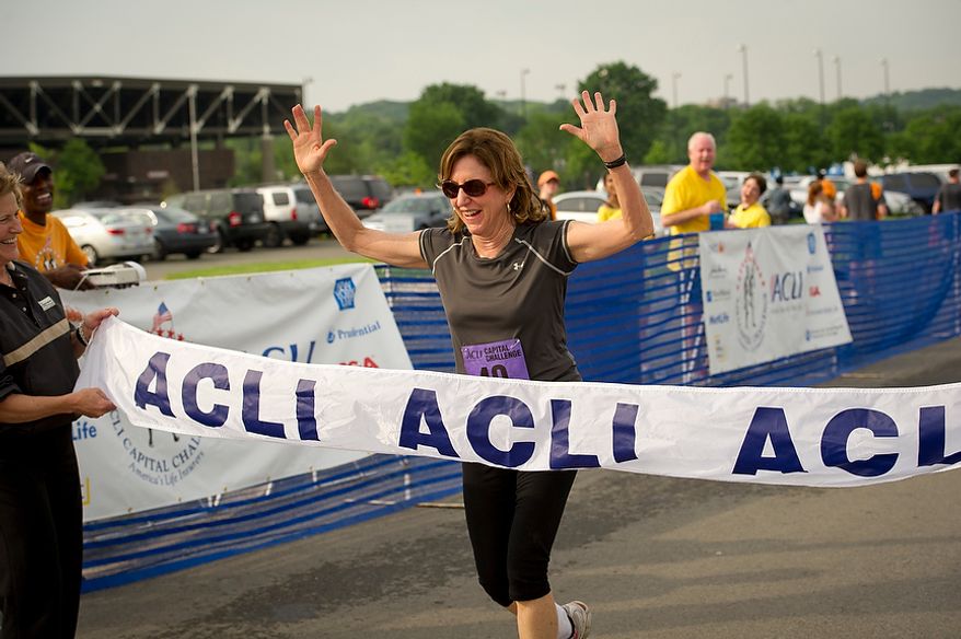Senator Kay Hagan (D-N.C.) crosses the finish line during the ACLI Capital Challenge at Anacostia Park in Washington, D.C., Wednesday, May 16, 2012. This is the 31st running of the three-mile race where members of Congress, national media outlets and locals take part in this fundraising event in the early morning hours along the water of the Anacostia River. (Rod Lamkey Jr/The Washington Times)