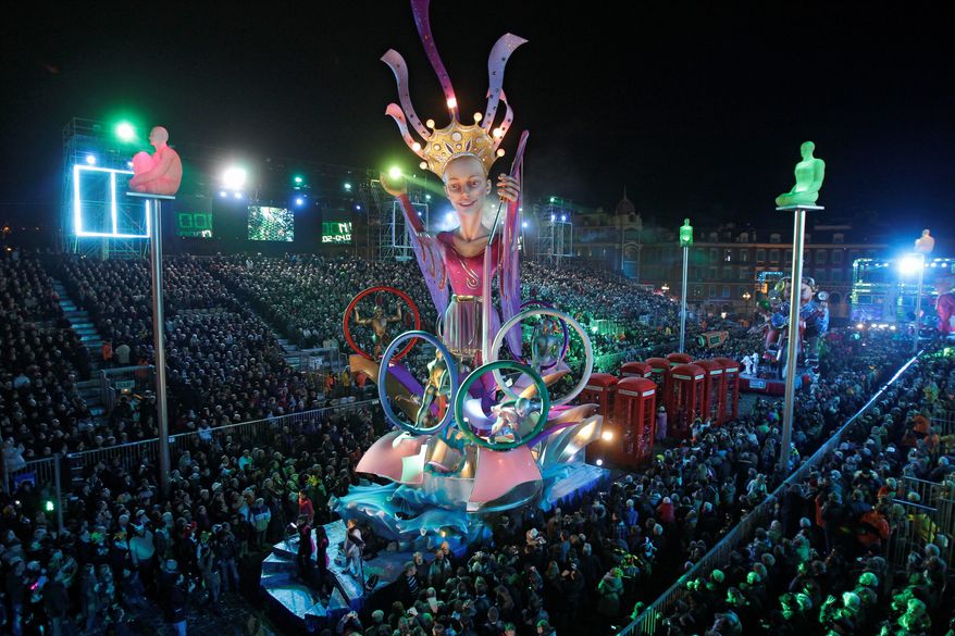 The float for the Queen of Nice Carnival 2012 parades past thousands of spectators. (Associated Press)