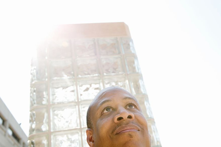 David Caruth, director of institutional research at the University of the District of Columbia, has written a book about overcoming poverty, dyslexia and the damage from a lightning strike that stole his ability to walk, read and write. "It doesn't matter how big the challenges are, there are ways to work through them," he says. (Rod Lamkey Jr./The Washington Times)