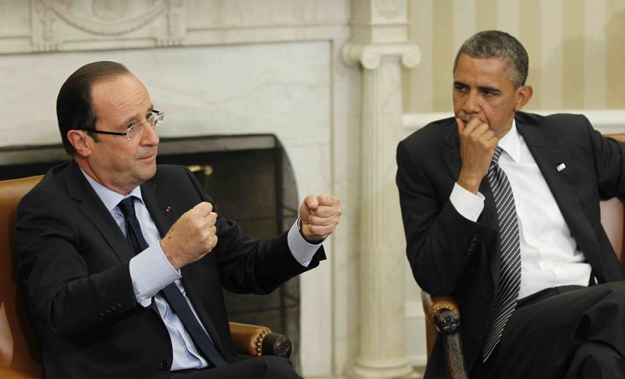 President Barack Obama, right, meets with French President Francois Hollande, left, Friday, May 18, 2012, in the Oval Office of the White House in Washington. (AP Photo/Pablo Martinez Monsivais)
