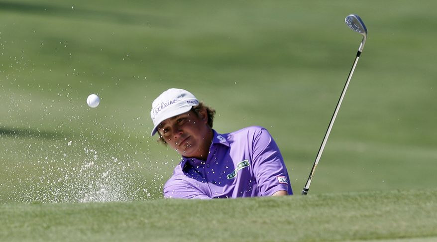 Jason Dufner hits out of the sand on the 16th hole during the third round of the PGA Byron Nelson Championship golf tournament Saturday, May 19, 2012, in Irving, Texas. (AP Photo/LM Otero)