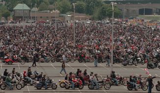 Motorcycle riders line up to participate in this year&#39;s Rolling Thunder parade, in the parking lot of the Pentagon on Sunday, May 27, 2001. ( Vance Jacobs / The Washington Times )