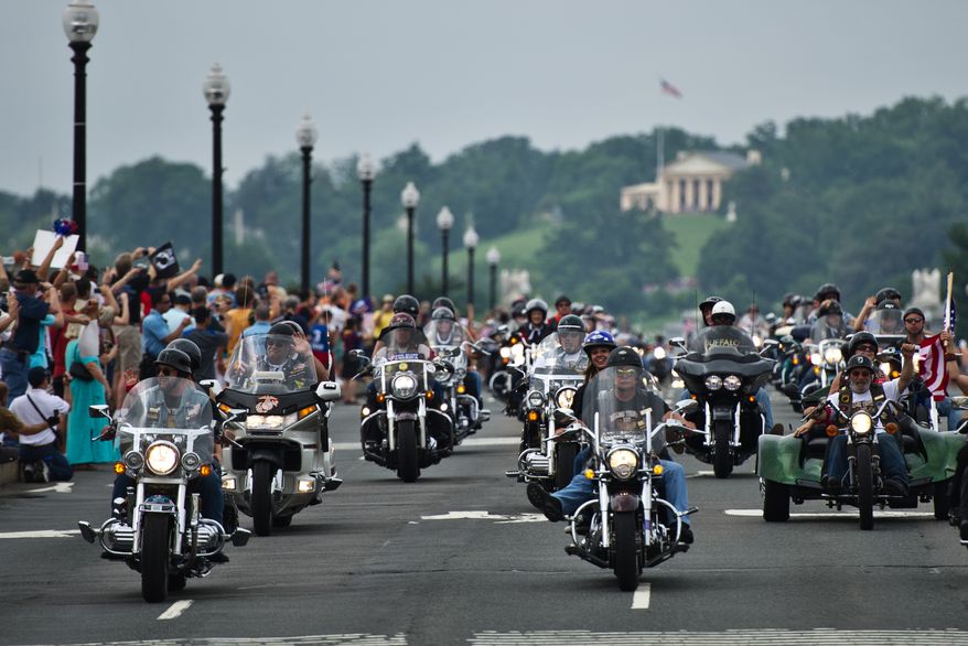 Participants in the Rolling Thunder annual motorcycle rally ride across Memorial Bridge near the National Mall during the Memorial Day weekend, in Washington, D.C., Sunday, May 29, 2011. The Rolling Thunder organization's mission is to bring awareness to the POW-MIA issue and to educate the public of the fact that many American prisoners of war were left behind after all past wars. (Drew Angerer/The Washington Times)