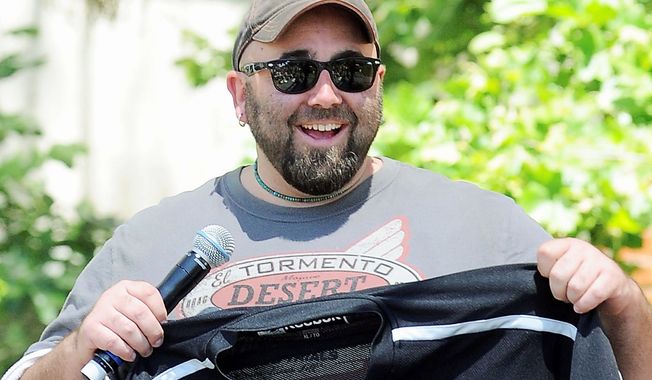 FILE - In this May 1, 2011 file photo, Duff Goldman, the cake master behind Food Network&#x27;s reality show &quot;Ace of Cakes, speaks at The Los Angeles Times Festival of Books at the University of Southern California in Los Angeles. YouTube&#x27;s latest original content channel, HUNGRY, which goes live on July 2, is expected to feature a freewheeling blend of how-to and celebrity-driven food videos. One of the series will feature Goldman&#x27;s &quot;Duff&#x27;s Food World,&quot; a sometimes irreverent variety show focused on food pop culture, including visits to unusual restaurants and spotlights of humorous food clips from the web and TV. (AP Photo/Katy Winn)