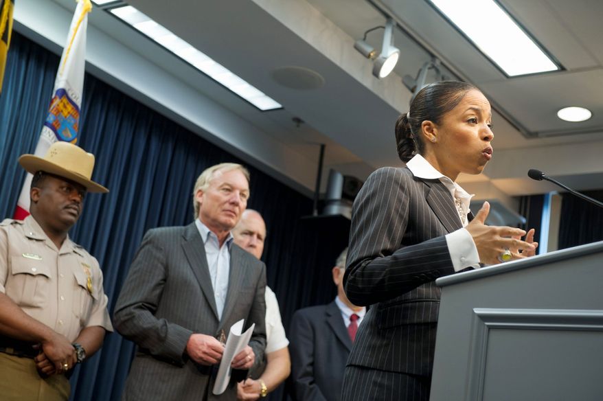 State's Attorney Angela Alsobrooks announced Tuesday that the owners and operators of seven nightclubs in Prince George's County were indicted for failure to pay taxes on cover charges, food and drinks served at their establishments. State Comptroller Peter V.R. Franchot (center) looks on during the press conference. (Barbara L. Salisbury/The Washington Times)
