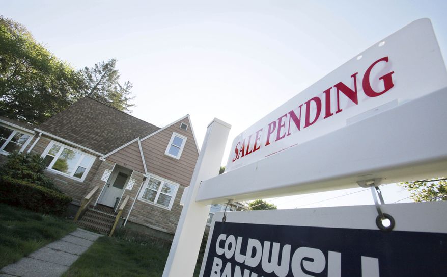 A real estate sign advertises a pending residential sale in Framingham, Mass., on Thursday, April 26, 2012. (AP Photo/Bill Sikes)