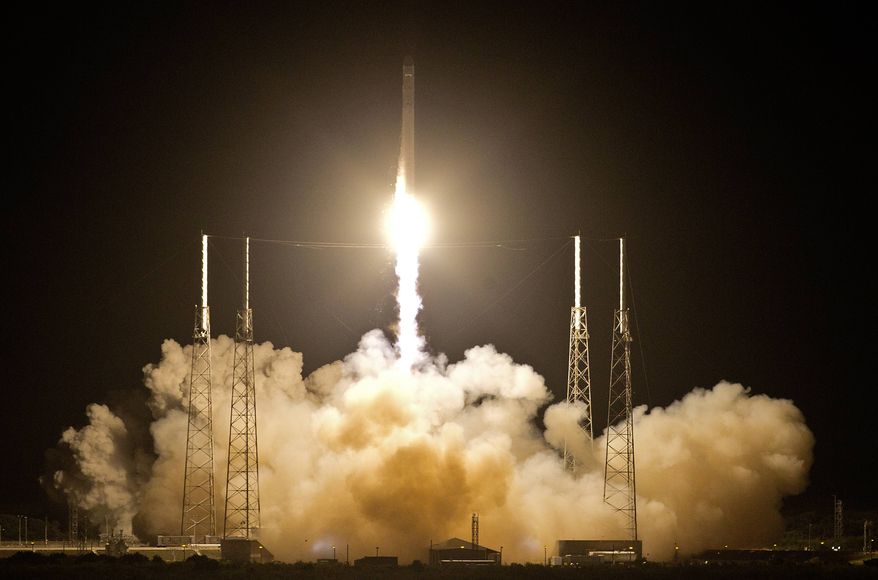 The Falcon 9 SpaceX rocket lifts off from Space Launch Complex 40 at the Cape Canaveral Air Force Station in Cape Canaveral, Fla., early Tuesday, May 22, 2012. The launch marked the first time a private company has sent its own rocket to deliver supplies to the International Space Station. (AP Photo/John Raoux)