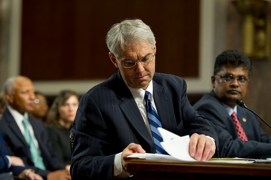 Mark Sullivan, left, director of the United States Secret Service, looks through notes while teatifying before the Committee on Homeland Security and Governmental Affairs at the Dirksen Building in Washington, D.C. on Wednesday, May 23, 2012, while Charles Edwards, acting inspector general of the U.S. Department of Homeland Security, looks on. (Barbara L. Salisbury/The Washington Times)