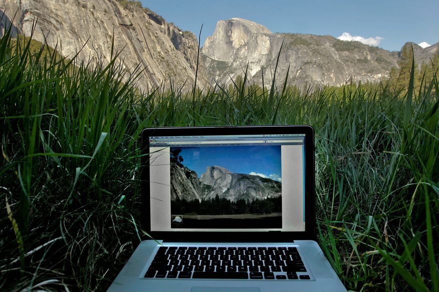 A live image of the Ahwahnee Meadow is displayed on a screen at Yosemite National Park in California. The Yosemite Conservancy has installed their latest webcam to give the public live online feeds of Yosemite Falls. They now have several webcam images online to also give visitors views of El Capitan, Half Dome and Sentinel Dome. (San Francisco Chronicle via Associated Press)